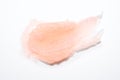 Smear of salt or sugar scrab on white background. Texture pink cosmetic scrub for face and body Royalty Free Stock Photo