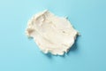 Smear of tasty cream cheese on color background