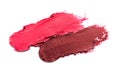 Smears of beautiful lipsticks on white background, top view