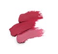Smears of beautiful lipsticks on white background, top view
