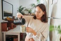 Smell that beautiful brew. a young woman pouring herself a cup of coffee. Royalty Free Stock Photo