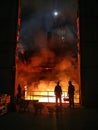 Smelting of metal in big foundry. Iron and steel production at a metallurgical plant. Steel worker. Metallurgy process
