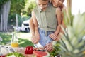 Mother teaching daughter how to prepare lunch