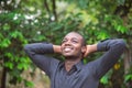 Smile african business man in green nature background Royalty Free Stock Photo