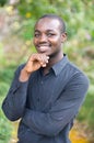 Smile african business man in green nature background Royalty Free Stock Photo