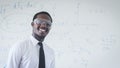Smile african teacher in white shirt is experimenting and explaining a science lesson in the classroom.Concept of sciences Royalty Free Stock Photo