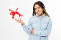 Smile afro american woman holding a gift box with red ribbon Royalty Free Stock Photo