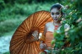 Smile ancient Thai Woman In Traditional Costume Of Thailand