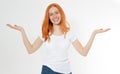 Smile beautiful red head girl show copy space hand in white t-shirt isolated on white background. Showing redhair woman - two Royalty Free Stock Photo