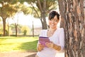 Smile brunette woman reading her ebook