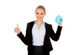 Smile business woman holding a paper house and show thumb up Royalty Free Stock Photo