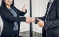 Smile Business woman and business man shaking hand and thumb up Royalty Free Stock Photo