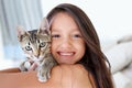 Smile, cat and portrait of child at her home cuddling, hugging and bonding with her animal. Happy, love and face of Royalty Free Stock Photo