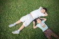 Smile children lie down on grass Royalty Free Stock Photo