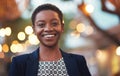 Smile, confident black woman and portrait in a city with bokeh, lights and blurred background space. Face, traveller and Royalty Free Stock Photo