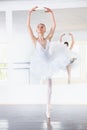 Smile, dance and teen student in ballet studio with pose, balance and performance class for teenager. Movement, talent