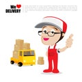 Smile delivery man thumb up on truck , and package delivery cart Royalty Free Stock Photo