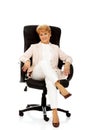 Smile elderly business woman sitting on armchair Royalty Free Stock Photo