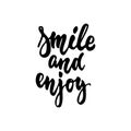 Smile and enjoy - hand drawn lettering phrase isolated on the white background. Fun brush ink inscription for photo