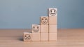 Smile face in bright side and sad face in dark side on wooden block cube for positive mindset selection concept Royalty Free Stock Photo