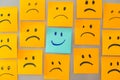 smile face sticky note surrounded by sad face stickynote Royalty Free Stock Photo