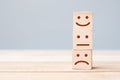 Smile face symbol on yellow wooden cube blocks. Emotion, Service rating, ranking, customer review, satisfaction and feedback Royalty Free Stock Photo