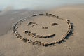 Smile face written in the sand Royalty Free Stock Photo