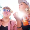 Smile, friends and women blowing bubbles outdoor in nature, play fun game at festival or freedom in summer. Happy young Royalty Free Stock Photo