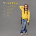 Smile fun school girl in eyeglasses holding backpack and thinking about the best education school rating, evaluation, online