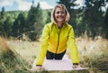 Smile girl exercising outdoors in green park, activity young fitness woman doing stretching exercises training outside Royalty Free Stock Photo