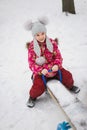 Smile girl sitting on a teeter-totter Royalty Free Stock Photo