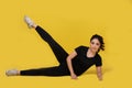 Smile happy Beautiful portrait young Asian woman stretching exercise workout on yellow background, fitness sport girl aerobic and Royalty Free Stock Photo