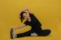 Smile happy Beautiful portrait young Asian woman stretching exercise workout on yellow background, fitness sport girl aerobic and Royalty Free Stock Photo