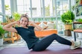 Smile happy Beautiful young Asian woman stretching exercise workout at home, fitness sport girl aerobic and healthy concept Royalty Free Stock Photo