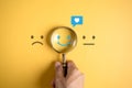 Smile happy face inside of magnifier glass with love icon massge between sad and normal emotion, Positive emotion, Mental health