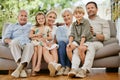 Smile, happy and portrait of big family on a sofa relaxing in the living room of modern house. Bonding, love and young Royalty Free Stock Photo