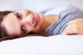Smile, happy and portrait of woman on bed for rest, daydreaming and comfortable at home. Blanket, relax and face of Royalty Free Stock Photo