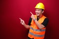 Smile and happy young asian man worker is with with hand point on empty space Royalty Free Stock Photo