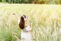 Smile happy young asian woman relaxing and using headphones to listen to music from smart phone Royalty Free Stock Photo