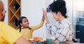 Smile, high five and a family eating breakfast in the kitchen of home together in the morning for health. Food, love or Royalty Free Stock Photo