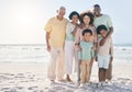 Smile, hug and portrait of a happy family at a beach for travel, vacation and holiday on nature background. Relax, face Royalty Free Stock Photo