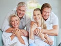 Smile, hug and portrait of happy family relax on living room sofa bonding, having fun and enjoy quality time together Royalty Free Stock Photo