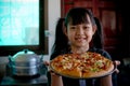 Smile little girl preparing homemade pizza Royalty Free Stock Photo