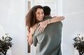Smile, love and a couple hugging in their home for support, care or romance in marriage together. Happy, trust and Royalty Free Stock Photo