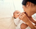 Smile, love and a mother with her baby on the bed in their home together for playful bonding. Family, kids and a happy Royalty Free Stock Photo