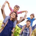 Smile, nature and children on parents shoulders in outdoor park or field for playing together. Happy, bonding and low Royalty Free Stock Photo