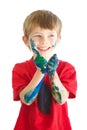 Smile, paint and a naughty or messy boy in studio isolated on a white background for art as a creative. Children, hands