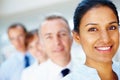 Smile, portrait of business woman with team in the office for positive, good and confident attitude. Happy Royalty Free Stock Photo