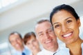 Smile, portrait of business woman with team in the office for positive, good and confident attitude. Happy Royalty Free Stock Photo