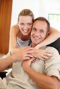 Smile, portrait and couple in embrace for marriage, love and proud of relationship milestone in home. Happy, hugging and Royalty Free Stock Photo